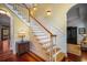 Elegant staircase featuring wood and white trim, leading to the upper level of the home at 5716 Bayshore Blvd, Tampa, FL 33611