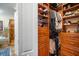 Well-organized walk-in closet with custom shelving and built-in drawers at 5716 Bayshore Blvd, Tampa, FL 33611