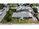 Home with lush lawn and a covered carport at 7030 Lois Ave, Longboat Key, FL 34228