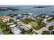Aerial view displays the property near shops, restaurants, and a stunning waterfront at 7030 Lois Ave, Longboat Key, FL 34228