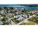Stunning aerial view of coastal community with waterfront properties and lush tropical landscaping near the bay at 7030 Lois Ave, Longboat Key, FL 34228