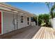 Cozy home with a covered wood patio, perfect for outdoor entertaining at 7030 Lois Ave, Longboat Key, FL 34228