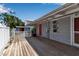 Charming backyard with a spacious wood deck and a white privacy fence at 7030 Lois Ave, Longboat Key, FL 34228