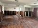 Spacious living room featuring hardwood floors with studs exposed at 7030 Lois Ave, Longboat Key, FL 34228