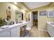 Bathroom featuring tile floors, separate vanity area and shower with grab bars at 705 Whitfield Ave, Sarasota, FL 34243