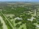 Expansive estate on acreage with a luxurious home, pool, and lush landscaping surrounded by a defined property line at 7234 Letitia Ln, Sarasota, FL 34241