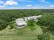Aerial view of property featuring a modern home, pool, and manicured yard at 7234 Letitia Ln, Sarasota, FL 34241