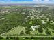 An aerial image showcases a large property, featuring a modern home and lush green surroundings within its boundary at 7234 Letitia Ln, Sarasota, FL 34241