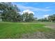 Expansive backyard with mature trees and well-manicured lawn at 7234 Letitia Ln, Sarasota, FL 34241