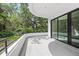Balcony overlooking lush greenery with a sliding glass door for indoor-outdoor living at 7234 Letitia Ln, Sarasota, FL 34241