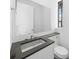 Modern bathroom featuring clean lines, gray countertops, and sleek fixtures at 7234 Letitia Ln, Sarasota, FL 34241