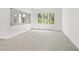 Bedroom with natural light, gray tile flooring, and minimalist design at 7234 Letitia Ln, Sarasota, FL 34241