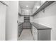 Spacious walk-in closet offering custom shelving and plenty of storage solutions at 7234 Letitia Ln, Sarasota, FL 34241