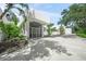 Home's entrance features modern design, potted plants, and ample space at 7234 Letitia Ln, Sarasota, FL 34241