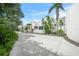 Unique home exterior with white walls and lush tropical landscaping at 7234 Letitia Ln, Sarasota, FL 34241