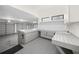 Spacious three car garage featuring built in cabinets and counter space, perfect for hobbies or storage at 7234 Letitia Ln, Sarasota, FL 34241