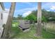 KOHLER generator on a concrete base surrounded by lush greenery and palm trees at 7234 Letitia Ln, Sarasota, FL 34241