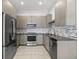 Modern kitchen with stainless steel appliances and stylish backsplash at 7234 Letitia Ln, Sarasota, FL 34241