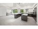 Modern kitchen with stainless steel appliances, gray cabinetry, and a center island at 7234 Letitia Ln, Sarasota, FL 34241