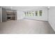 Open-concept living room showcasing tile floors and natural light at 7234 Letitia Ln, Sarasota, FL 34241