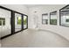 Bright living space featuring tile flooring, multiple windows, and an open floor plan at 7234 Letitia Ln, Sarasota, FL 34241