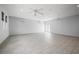 Spacious living room with tile flooring, recessed lighting, and ceiling fans at 7234 Letitia Ln, Sarasota, FL 34241
