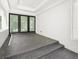 Modern patio with sleek tile flooring and large sliding glass doors at 7234 Letitia Ln, Sarasota, FL 34241