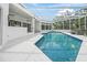 Enclosed pool area featuring a swimming pool, hot tub, and ample space for lounging at 7234 Letitia Ln, Sarasota, FL 34241