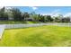 View of backyard with large green lawn and white vinyl fence at 7526 Ridgelake Cir, Bradenton, FL 34203