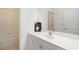 Bright bathroom featuring a white vanity with a white sink and a bathtub and shower combination at 7526 Ridgelake Cir, Bradenton, FL 34203