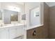 Stylish bathroom featuring a large mirror, modern vanity, and glass-enclosed shower for a luxurious feel at 7526 Ridgelake Cir, Bradenton, FL 34203