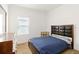 Bedroom features a modern bed frame, side table, and dresser at 7526 Ridgelake Cir, Bradenton, FL 34203