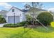 Lovely home featuring a well-kept lawn, mature landscaping, and a two-car gray garage door at 7526 Ridgelake Cir, Bradenton, FL 34203