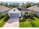 Charming home with a two-car garage, well-maintained landscaping, and inviting curb appeal at 7526 Ridgelake Cir, Bradenton, FL 34203