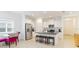 Modern kitchen featuring white cabinets, stainless steel appliances, and a central island with seating at 7526 Ridgelake Cir, Bradenton, FL 34203