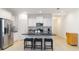 Modern kitchen features stainless steel appliances, sleek black countertops, and ample white cabinets at 7526 Ridgelake Cir, Bradenton, FL 34203