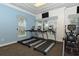 A gym equipped with treadmills and elliptical machines, offering a range of fitness options at 8352 Enclave Way # 104, Sarasota, FL 34243