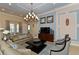 Comfortable living room featuring contemporary decor, modern lighting, and a TV for entertainment at 8352 Enclave Way # 104, Sarasota, FL 34243