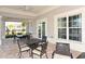 Covered patio featuring seating, ceiling fans, and brick pavers perfect for outdoor enjoyment at 8352 Enclave Way # 104, Sarasota, FL 34243
