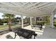 Community picnic shelter with picnic tables and view of bocce ball court at 8352 Enclave Way # 104, Sarasota, FL 34243