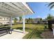 Community picnic shelter with view of lawn and community residences at 8352 Enclave Way # 104, Sarasota, FL 34243