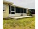 The backyard features a screened-in patio and a well-maintained lawn at 8508 43Rd W Ave, Bradenton, FL 34209