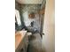 Bathroom with vanity, patterned wallpaper, toilet, and tiled floors at 8508 43Rd W Ave, Bradenton, FL 34209