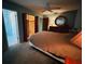 Cozy bedroom showcasing neutral tones, dresser, and walk-in closet access at 8508 43Rd W Ave, Bradenton, FL 34209