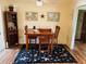 Comfortable dining area with wood table, seating for four, and stylish rug at 8508 43Rd W Ave, Bradenton, FL 34209