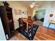 An inviting dining area features a wooden table and chairs, and hardwood floors at 8508 43Rd W Ave, Bradenton, FL 34209