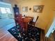 Cozy dining room with wooden table, three chairs, and artwork on the walls at 8508 43Rd W Ave, Bradenton, FL 34209