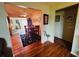 A dining area showcases wood floors, a table with chairs, and backyard access at 8508 43Rd W Ave, Bradenton, FL 34209