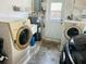 Garage features laundry machines, a utility sink and access to the outside at 8508 43Rd W Ave, Bradenton, FL 34209