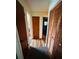 Hallway featuring wood-look floors and closet with wood panel doors at 8508 43Rd W Ave, Bradenton, FL 34209